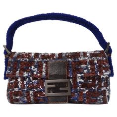 Show stopping Fendi monogram baguette covered in sequins! This stunning handbag features a plethora of navy, silver and ruby brown sequins alongside brown leather and metal Fendi engraved hardware complimented by a navy sherpa handle. Could this bag get any more unique?! This is the perfect statement piece thats begging to be added to your baguette collection. Shine bright on a night out and pair this with your favorite YSL evening dress and Versace pumps or elevate your casual brunch look by ma Fendi Sequin Baguette, Fendi Vintage Baguette, Vintage Fendi Baguette, Versace Pumps, Statement Fashion Pieces, Fendi Monogram, Fendi Baguette Bag, Fendi Purses, Fendi Vintage