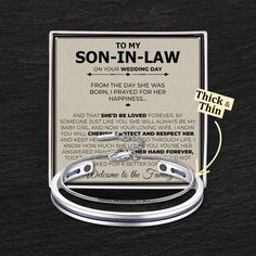 a silver bracelet with the words son - in - law on it