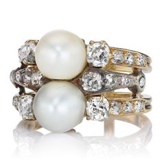 Antique Pearl + Diamond Ring The Allora ring is an authentic vintage pearl and diamond ring from the Victorian Era circa 1890. The ring features two GIA-certified Natural Saltwater Pearls. Twenty four old mine cut diamond of approximately J-K color, VS-SI clarity combining for approximately 1.90-carats are set halfway along each of the three shanks. The stones are set in a silver and 18kt yellow gold double-band setting. The ring is currently size 5.75 and can be resized to some sizes! Why We Lo Victor Barbone Jewelry, Victor Barbone, Pearl Diamond Ring, Antique Diamond Engagement Rings, Antique Engagement Rings Vintage, Old Mine Cut Diamond, Saltwater Pearls, Pearl And Diamond Ring, Antique Diamond Rings