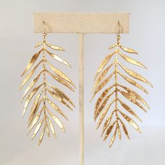 I have made this stunning pair of earrings using the most beautiful Italian gold leather. They are so incredibly lightweight, you will forget that you are even wearing earrings. They are intricately cut to give the appearance of a delicate fern leaf. They measure 3 inches in length and the earring hooks are gold plated. Bridal Jewellry, Bride Groom Outfits, Leather Leaf Earrings, Joshua Tree Elopement, Earrings Feather, Leather Leaf, Fern Leaf, Light Earrings, Fan Earrings