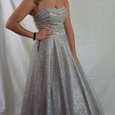 Stunning Silver Dress By Alexia. Size 6. Worn Once, Cleaned. Silver Sleeveless Dress For Banquet, Silver Strapless Dress With Fitted Bodice, Silver Ball Gown Dress For Gala, Silver Ball Gown For Evening, Silver Dresses For Gala During Prom Season, Silver Dress For Gala Or Prom, Silver Prom Dress With Fitted Bodice, Silver Strapless Dress For Prom Season, Silver Strapless Dress For Prom