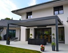 a large white house with an attached patio