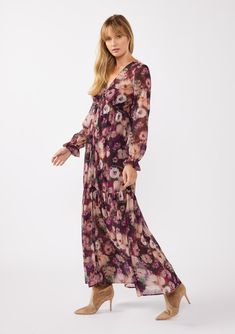 A bohemian holiday maxi dress, crafted in a lightweight chiffon with a dreamy purple floral print. Floral chiffon Relaxed fit Maxi length Voluminous long sleeves Ruffled elastic wrist cuffs Tiered skirt V-neckline Empire waist Button front Sheer Lining attached Bohemian holiday maxi dress Dry clean recommended or hand wash cold Twirl into the holiday season with our flowy chiffon maxi dress in a beautiful floral print. This lightweight, effortless dress features a flattering v-neckline, a relaxe Boho Holiday Dress, Bohemian Holiday, Holiday Maxi Dress, Purple Floral Print, Chiffon Maxi, Chiffon Maxi Dress, Wrist Cuffs, Floral Chiffon, Tier Skirt