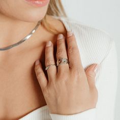 Upgrade your everyday style with the Gianna Ring in Silver. This chunky ring adds a touch of boldness to any outfit while also emphasizing your fashion-forward taste. Stand out in style with the Gianna Ring and elevate your look. *Also available in GOLD PRODUCT DETAILS Width: 1/2" Metal: Rhodium Plated Brass Trendy Open Ring For Promise, Trendy Open Ring For Promise Occasion, Elegant Everyday Silver Heart Ring, Trendy Open Ring For Everyday Wear, Trendy Open Initial Ring For Promise, Trendy Initial Open Ring For Promise, Open Crystal Ring For Promise, Nickel Free Rings For Everyday Wear, Everyday Metal Midi Rings With Open Design