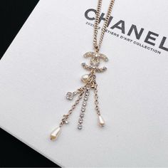 Authentic Chanel Pearl Crystal Chain Cc Multi Strand Necklace. Light Gold Color, Cc Pendant With Iridescent Crystals. Multi Strand With Free Form Faux Pearl And Crystals. Comes With The Original Box And Pouch. Like New Condition. Made In France. Size: 16-23 Inch Adjustable. Pendant Is 3.25*0.9 Inch. Elegant White Crystal Chain Necklace, Luxury Pearl Chain Necklace, Elegant Pendant Chain Necklace With Logo Charm, Elegant White Jewelry With Logo Charm, Elegant White Necklace With Logo Charm, Luxury White Chain Necklace With Adjustable Chain, Luxury White Clavicle Chain Necklace, Luxury Chain Necklace With Logo Charm, Luxury White Necklace With Chain Detail