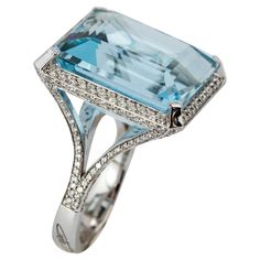 "Costis" Aquamarine Ring with 29.42 carats Aquamarine and Diamonds A simple, yet elegant setting to celebrate remarkable aquamarines. Every design is a challenge, starting from the highly demanding three-dimensional pieces, to the ostensibly simplest settings. Costis actually believes that what seems to be simple in appearance is the hardest to achieve. This does not mean less hours in the design room and in the workshop, but instead respect to the quality and value of the central gemstones. 18K White Gold. The ring features a 29.42 carats central stone surrounded with a total of 1.55 carats of Diamonds. Aquamarines remind Costis the hues of the Greek surroundings... the sea, the sky, the horizon... characteristics that he always uses in his pieces. Be Simple, Aquamarine Ring, Design Room, Aqua Marine, Aquamarine Rings, The Horizon, Cocktail Rings, Works Of Art, Aquamarine