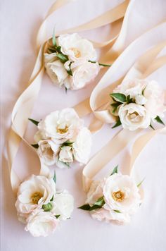 wedding bouquets with white flowers and satin ribbons