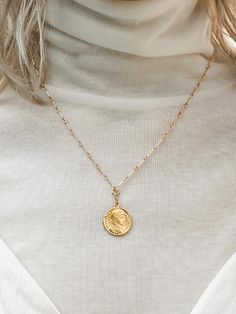 - Detachable coin pendant- Slim link chainMeasurements- Length: 18.1- Pendant: 0.7Composition- Gold FilledDesigner- Made in U.S.A- by NINETEEN TWO- Style#: 300782522 Elegant Coin-shaped Chain Necklace With Adjustable Chain, Gold Plated Coin Jewelry With Delicate Chain, Gold Plated Delicate Chain Jewelry With Coin Shape, Elegant Coin Necklace With Chain, Gold Medallion Coin Necklace With Cable Chain, Elegant Coin Medallion Necklace With Adjustable Chain, Minimalist Chain Necklace With Coin Pendant, Elegant Coin Medallion Necklace With Chain, Yellow Gold Coin Pendant Chain Necklace