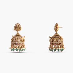 Description: Indulge in the epitome of elegance with our captivating antique gold-plated 925 silver jhumka earrings. Masterfully handcrafted, these earrings feature intricate peacock and floral motifs, dazzling Kempu stones, CZ stones, and bead drops. The stud part features the Goddess Lakshmi motif each detail reflects timeless luxury and charm. Product Information: Metal: 925 Silver with Antique Gold Plating Length: 5cm Stones: High Grade CZ Stones Findings: Push back Antique Gold Lakshmi Earrings, Temple Jewelry Jhumkas With Intricate Design For Diwali, Temple Jewelry Style Kundan Jhumkas With Intricate Design, Traditional Kundan Filigree Earrings, Ornate Earrings With Intricate Design For Diwali, Temple Jewelry Style Brass Cutdana Earrings, Brass Cutdana Temple Jewelry Earrings, Yellow Gold Kundan Jhumkas With Intricate Design, Temple Jewelry Style Brass Earrings With Cutdana