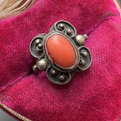 Cute  Old  ~ 800 silver ~ oval coral ring with beautiful details. Faded 800 mark on outer side of band . Dates early 20th century  Materials : solid Silver coral cab Measurements :  Small ring size ( pinky finger ) ~ Can fit ring size  41/2 - 5  ~ Top measures 1/2  inches x 1/2 inches wide . Weighs 3 grams on my weighing scale. Condition : Overall good vintage condition with heavy age patina to silver ~ no major cracks or chips to the  cab (some surface wear  )~ The setting of coral of coral is Vintage Oval Engraved Ring Stamped 925, Vintage Coral Jewelry For Anniversary, Coral Vintage Jewelry For Anniversary, Vintage Pink Cabochon Ring, Antique Handmade Oval Rings, Vintage Oval Coral Jewelry, Vintage Coral Oval Jewelry, Vintage Coral Rings As A Gift, Antique Oval Pink Rings