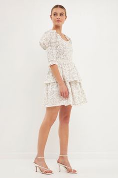 Delicate and dainty. That's what you'll feel like in our Lace Trim Floral Print Smocked Sleeve Mini Dress. With a floral print, lace trim, smocked bodice, and tiered ruffles, this dress is perfect for your next special event. And the best part? You'll feel like a fairytale princess while wearing it. Trust us, you'll want to twirl the night away in this gorgeous dress. Floral print Lace trim Smocked bodice Smocked sleeves Mini length Tiered ruffles Lining Hand wash cold Do not bleach Do not tumbl Fitted Smocked Dress With Ditsy Floral Print For Daywear, White Smocked Dress With Floral Print And Square Neck, White Smocked Floral Print Dress, White Smocked Dress With Floral Print For Spring, White Smocked Dress With Floral Print, Daywear Floral Print Smocked Mini Dress, White Floral Print Smocked Dress, White Smocked Square Neck Dress For Spring, White Ditsy Floral Print Puff Sleeve Dress