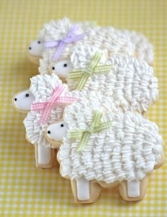 an image of some sheep made out of cookies on top of a yellow and white checkered table cloth