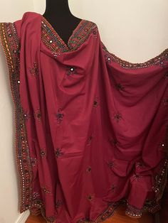 "Brand new without tags Balochi fully hand embroidered with mirror work Full size chaddar dupatta Size:92\"x 52\" inches  Color:Maroon Fabric:Cotton Silk ❌No Return Or Exchange❌ ➡️Feel free to message us if you need more pictures, measurements and details about the dress." Red Unstitched Salwar Kameez With Handwork, Festive Pink Dupatta With Handwork, Festive Pink Handwork Dupatta, Designer Handwork Dupatta In Chinon, Navratri Embroidered Dupatta In Chinon, Traditional Nida Salwar Kameez With Mirror Work, Embroidered Unstitched Nida Suit For Diwali, Pink Handwork Dupatta For Festive Occasions, Embroidered Nida Salwar Kameez For Diwali