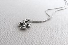 A beautiful Maltese Cross pendant in 925 sterling silver. This hand crafted cross is double sided and hangs from a beautiful, dainty chain. The entire necklace is made of 925 sterling silver with an antique finish to bring out the detailing and shine. This necklace is Nickel-Free and hypoallergenic. Material: 925 Sterling Silver Pendant Size: about 1 inch Chain Length: 16 inches *All purchases will arrive in a gift box! *Available in silver and in bronze *All orders are shipped via USPS First Cl Sterling Silver Necklace With Oxidized Cross Pendant, Sterling Silver Cross Necklace Hallmarked, Sterling Silver Cross Necklace, Hallmarked, Sterling Silver Necklace With Cross Pendant Stamped 925, Hallmarked Sterling Silver Cross Necklace, Sterling Silver Oxidized Crucifix Necklace, Oxidized Sterling Silver Cross Pendant Necklace, Spiritual Silver Cross Necklace With Oxidized Finish, Engraved Sterling Silver Cross Necklace