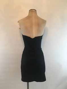 "Strapless Caché dress with sunburst grey/black fabric has a silk sharkskin appearance, sweetheart neckline and zips up in the back with boning on each side of the bodice. Dress is fully lined in black satin and is stretchy and made with a mid weight fabric that looks rich. In excellent vintage condition. Made by Cache, there are no fabric content tags, Bust up to 34\" Waist 24\", up to 26.5\" Hips 32\", up to 36\" Length 27\" Vintage garments have been previously worn and lovingly cared for, th Fitted Knee-length Strapless Dress With Lining, Strapless Lined Bodycon Dress, Strapless Bodycon Lined Dress, Evening Lined Corset Dress With Sweetheart Neckline, Lined Sweetheart Neckline Corset Evening Dress, Lined Sweetheart Neckline Evening Corset Dress, Lined Sheath Bodycon Dress For Evening, Knee-length Lined Strapless Dress For Date Night, Fitted Mini Dress With Back Opening For Cocktail