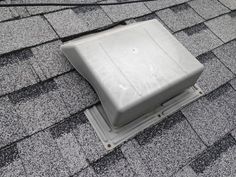 an air vent on the roof of a house