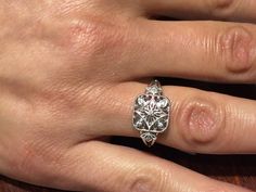 "The item is a sterling silver filigree diamond ring. The ring weighs 2.6 grams and is a finger size 7. The top part of the ring measures 11 millimeters wide and the bottom part of the ring measures 2 millimeters wide. The seven diamonds weigh .05 carats. The diamonds are a \"G\" color and \"SI2\" clarity. I can adjust the size on it . I will provide a ring box with the ring." Filigree Diamond Ring, Silver Diamond Ring, Hot Jewelry, Sterling Silver Filigree, Wedding Rings Unique, Lovely Ring, Classic Jewelry, Silver Filigree, The Seven