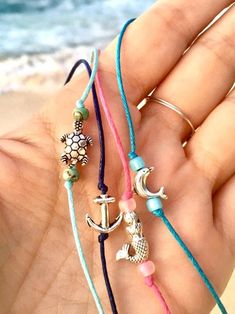 "this set of 2 or 4 wish friendship bracelets is a perfect group gift for beach and ocean loving girls. great for beach theme birthday parties or special play dates 💕 perfect friendship gift, best friends, sisters, cousins.  you can choose from 2 sets of 2, or all 4, or customize any combination you wish! * sea turtle * anchor * mermaid * dolphin they each come on different color waxed cotton cord with high quality glass accent beads.  the anchor comes with no beads colors may vary slightly. leave a note with color request, all the same color or charm, or any combination you wish! PLEASE MESSAGE ME FOR LARGER QUANTITIES AND/OR DIFFERENT COLORS  handmade with aloha by me in Hawaii.  one size fits all (16\") just tie on and leave on! cut extra cord if too long.  can be worn as bracelet or a Kids Friendship Bracelets, Summer Ankle Bracelets, Bracelets Beachy, Beach Theme Birthday Party, Mermaid Dolphin, Boy Bracelet, Beach Theme Birthday, Bracelets Beach, Bracelets Christmas