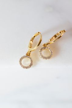 Our Myla Dainty O-Ring Huggie Earrings are the perfect minimalist earrings! Made with a crystal beaded gold filled O-Ring attached to a gold filled huggie hoop. These simple earrings are a beautiful staple piece! Gold Dangle Hoop Earrings With Halo Design, Everyday Gold Crystal Earrings, Gold Halo Design Dangle Jewelry, Minimalist Gold Jewelry With Halo Design, Gold Dangle Jewelry With Halo Design, Gold Huggie Earrings With Sparkling Stones, Gold Huggie Jewelry With Sparkling Stones, Gold Huggie Earrings With Halo Design As Gift, Gold Drop Earrings For Everyday