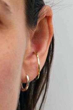 Handmade oversize 9ct gold hoop for conch piercing or other cartilage piercings. Handcrafted from 100% recycled solid gold, textured and polished to a high shine. Ethical piercing jewellery handcrafted in the UK to your requirements. Available in smaller size for your helix, nose and lip piercings. Stack it or wear alone. Endless hoop style - with the opening at the top, hold each side at the bottom and twist to open (do not pull outwards which would cause it to loose a circular shape!) insert, Conch Ring, Conch Piercings, Conch Hoop, Silversmith Jewellery, Helix Hoop, Piercing Jewellery, Plug Earrings, Conch Earring, Conch Piercing