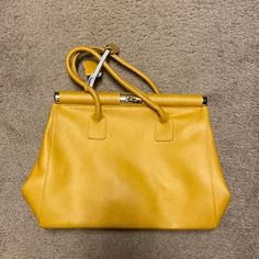 Bought It In Italy And Never Used. Leather! Gold Top Handle Satchel With Hasp Closure, Yellow Top Handle Satchel For Office, Yellow Crossbody Satchel For Office, Yellow Office Bags With Double Handle, Gold Leather Shoulder Bag With Hasp Closure, Classic Yellow Office Bag, Classic Yellow Satchel With Gold-tone Hardware, Classic Yellow Crossbody Satchel, Classic Yellow Rectangular Shoulder Bag