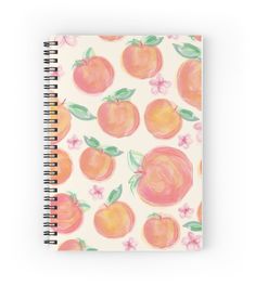 a spiral notebook with peaches on it