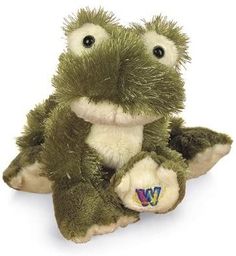 a stuffed frog sitting on top of a white surface with the letter w in it's eyes