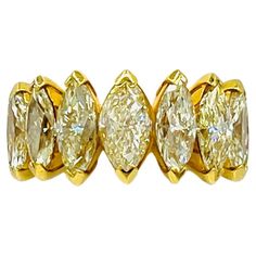 Gorgeous 7.73 ct. natural yellow diamond marquise shapes. Total of 9 stones. Ring size 6.75. Yellow Marquise Diamond Ring, Yellow Marquise Rings For Anniversary, Gia Certified Yellow Gold Marquise Diamond Ring, Gia Certified Marquise Yellow Gold Jewelry, Yellow Marquise Cut Jewelry For Anniversary, Yellow Marquise Fine Jewelry, Marquise Band, Marquise Diamond Ring, Marquise Ring