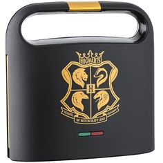 the hogwarts crest is shown on this black and gold lunchbox