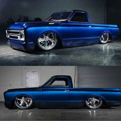 an old blue truck with chrome rims parked in a garage next to another one