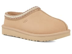 UGG Tasman - Women's Shoes : Driftwood : The Tasman always fits tight at first especially if someone has a high instep or high volume foot. It does stretch out over time. If you are in between sizes, please size up or down based on the volume of your foot and height of your instep. Take the suede UGG Tasman slip-on from weekday lounging to a Saturday excursion! Features a Tasman trim and a raw seam down the center with an embossed UGG logo at lateral side. Luxurious sheepskin lining for breathab Tasman Uggs Light Brown, Women’s Cute Shoes, Shoes To Ask For, Driftwood Tasman Uggs, Christmas Wishlist Shoes, White Tasman Uggs, Taxman’s Uggs, Uggs Slippers Tasman, Ugg Tasman Mustard Seed