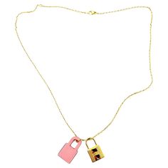 Hermes Gold Pink O Kelly Necklace * Marked Hermes *D stamp/ 2019 * Made in France *Comes with the original box, pouch and cards. -It's approximately 19". -The pendants are approximately 1" x 0.55". -In a pristine condition 2034-47012 Designer Chain Necklace For Gift, Luxury Pink Jewelry With Chain, Luxury Pink Chain Necklace, Luxury Pink Jewelry With Logo Charm, Luxury Lock Jewelry For Gift, Luxury Jewelry Gift With Logo Charm, Luxury Logo Charm Jewelry For Gift, Pink Jewelry With Logo Charm For Gifts, Luxury Pink Necklace For Gift