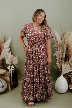 We are adoring the delicate floral pattern on this dress that makes it stand apart from the rest. Our Many Moments Floral Maxi Dress features a v-neckline, elastic waistband, cap flutter sleeves, and a three tiered design skirt. A true essential that transitions flawlessly throughout the seasons! Neckline: V-neckline Fabric: 100% Polyester Details: Lined, Elastic waistband, delicate floral print, tiered skirt Imported Fit: True to size; relaxed fit- Arms: Relaxed flutter sleeve- Chest: Relaxed- Modest V-neck Floral Print Dress, Brown V-neck Dress For Garden Party, Modest Floral Print Dress For Fall, Flowy Ditsy Floral Print Dresses For Fall, Brown Floral Print V-neck Dress, Flowy Short Sleeve Maxi Dress For Fall, Modest Flowy Rayon Dress, Casual Floral Print Maternity Midi Dress, Casual Maternity Midi Dress With Floral Print