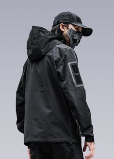 Unleash your inner cyber goth with our futuristic Techwear Jacket. Introducing the Men's Futuristic Jacket - the perfect combination of style and functionality designed to elevate your fashion charisma to the next level. This black windbreaker jacket draws inspiration from steampunk and cyber-goth clothing, delivering a unique industrial fashion aesthetic that will turn heads. Crafted with Japanese streetwear influences, this futuristic jacket is lightweight and functional, designed to protect y Cyberpunk Outerwear With Detachable Hood For Streetwear, Techwear Long Sleeve Outerwear For Cosplay, Black Cyberpunk Outerwear With Detachable Hood, Techwear Long Sleeve Hooded Jacket, Long Sleeve Techwear Outerwear For Cosplay, Long Sleeve Techwear For Cosplay, Black Techwear Outerwear For Cosplay, Black Hooded Cyberpunk Outerwear, Winter Techwear Outerwear For Cosplay