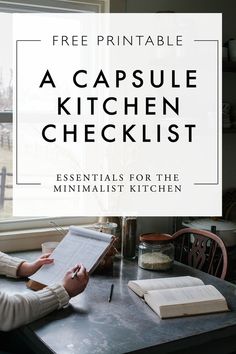 a person sitting at a table with a book and pen in front of them that reads, free printable a capsule kitchen checklist essentials for the minimalist kitchen