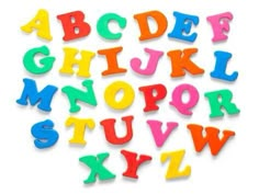 colorful plastic letters and numbers are arranged in the shape of an alphabet on a white background