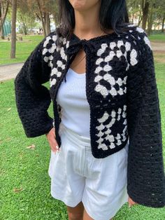 This chic black and white crochet cardigan offers both a modern look and comfort! 🖤🤍 Designed for women, it fits perfectly for S and M sizes. It keeps you cozy on cold days while maintaining a stylish, elegant appearance. 🧶✨ Perfect for adding a touch of charm to any outfit, this crochet cardigan is a must-have piece in your wardrobe! Chic Crochet Long Sleeve Cardigan, Chic Long Sleeve Crochet Cardigan, White Winter Outerwear With Granny Square Details, White Long Sleeve Cardigan With Granny Squares, White Granny Square Cardigan For Spring, Casual Granny Square Cardigan For Spring, Chic White Crochet Top For Winter, Black Granny Square Winter Cardigan, Black Granny Square Cardigan For Winter