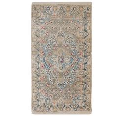 a rug with an ornate design on the front and back side, in beige tones