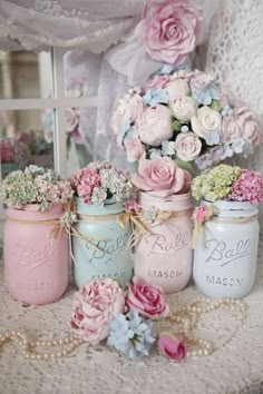 pink and blue mason jars filled with flowers