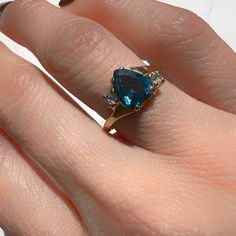 London Blue Topaz Ring 14K Yellow Gold Heart Shape Blue Topaz 8mm x 6.2mm 1.9gm Size 5.5 Sizing available with fee contact us to have it added to the price before check out. Thank you for visiting our shop! Visit our website DmKJewelry.com Also Follow us on Instagram https://www.instagram.com/dmkjewelry_/ Blue Sapphire Heart Cut Ring, Blue Heart Cut Sapphire Gemstone Ring, Blue Heart Cut Sapphire Ring, Classic Blue Heart Cut Ring, Classic Blue Heart Cut Rings, Blue Heart Cut Birthstone Ring For Anniversary, Blue Trillion Cut Topaz Ring With Accent Stones, Fine Jewelry Blue Pear-shaped Topaz Ring, Blue Topaz Ring With Pear-shaped Center Stone