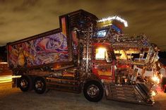 a semi truck decorated with art and lights