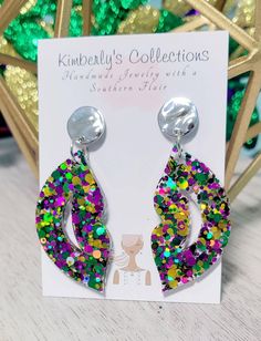 Purple green and gold fun Mardi Gras earrings. Made with glitter and resin, lightweight. Comes with gold tone studs, lead and nickel free. Will come gift wrapped, ships free. Hang down 2 in. from ear. Green Pierced Jewelry For Party, Fun Gold Jewelry For Party, Trendy Glitter Earrings For Party, Green Pierced Earrings For Party, Handmade Green Earrings For Birthday, Handmade Green Earrings For Birthdays, Party Earrings With Resin Ear Wire, Nickel-free Green Earrings For Party, Party Earrings With Ear Wire In Resin