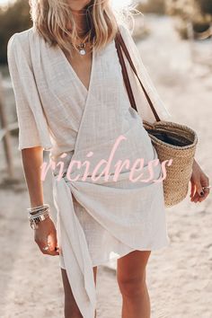 Easy Breezy Cotton Linen Blend Knotted Wrap Mini Dress Chic Solid Color Mini Dress For The Beach, Casual Wrap Maxi Dress For Beach, Casual Wrap Maxi Dress, Solid Color Beach Dress For Spring, Casual Wrap Maxi Dress For Summer, Casual Summer Wrap Maxi Dress, Summer Wrap Dress With Tie Waist For Vacation, Long Sleeve Beach Wrap Dress With Tie Waist, Spring Vacation Wrap Maxi Dress