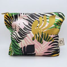 Cosmetic bag / Wash bag - Organic cotton - Tropics This product is designed by me. Priscilla, a London based printed textile designer. The fabric is printed in the UK by an independent printers.  Fully lined with organic cotton and is washable. The gold metal zip gives this bold and brightly coloured cosmetic bag the perfect finishing touch! Size: 18cm x 24cm x 6cm Green Rectangular Cosmetic Bag For On-the-go, Green Rectangular Pouch For On-the-go, Tropical Multicolor Bags For Daily Use, Eco-friendly Rectangular Cosmetic Bag For Daily Use, Multicolor Travel Bag With Zipper Pouch, Green Rectangular Cosmetic Bag For Travel, Trendy Multicolor Bags For Personal Use, Modern Multicolor Pouch Bag, Eco-friendly Zipper Pouch Bag