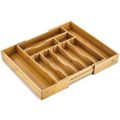 a wooden tray with compartments on it