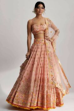 This lehenga set is perfect for a glamorous wedding ceremony, as it exudes elegance and grace. The vibrant colors and shimmering sequins make it a statement piece that will surely turn heads and leave a lasting impression. Be prepared to steal the spotlight and make a memorable entrance in the ruah gathered lehenga set. Its beautiful craftsmanship, intricate details and vibrant colors will make you feel like a queen on your special day. Pink Georgette Lehenga, Gathered Lehenga, Middle Class Family, Gopi Vaid, Class Family, Mehendi Outfit, Lehenga Design, India Trip, Indian Outfits Lehenga