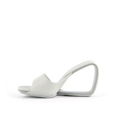 Modern Open Toe Mules With Heel Loop, Modern Slides With Sculpted Heel, Modern Formal Slide Mules, Modern Slides With Padded Heel, Modern Slip-on Slides With Padded Heel, Modern High Heel Mules With Heel Loop, Modern Sandals With Heel Loop And Open Heel, Modern Evening Slides With Sculpted Heel, Modern Formal Slides With Open Heel