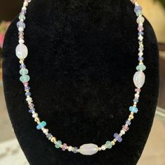 This one-of-a-kind necklace features a beautiful combination of precious gemstones and metal beads. We offer this stunning piece in our favorite gemstone combinations but can custom design patterns upon request. Handcrafted with 14k gold and nylon stringing Features etiher opal, ruby, tanzanite, and pearl or onyx and black diamonds Available in 16" length with a lobster clasp closure Because our pieces are all made entirely by hand we can offer a huge array of customization. If you have inquirie Elegant Rondelle Beads With Natural Stones, Elegant Rondelle Crystal Necklace For Healing, Artisan Gemstone Rondelle Necklace, Multicolor Single Strand Jewelry For Healing, Adjustable Gemstone Rondelle Necklaces, Adjustable Rondelle Gemstone Necklace, Healing Single Strand Round Bead Gemstones, Elegant Necklaces With Oval Natural Stones, Bohemian Gemstone Rondelle Necklaces