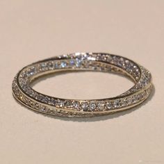 an image of a wedding ring with diamonds