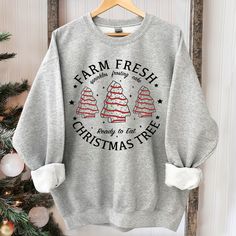 Farm Fresh Christmas Tree Cakes Shirt Christmas Cake Sweatshirt Christmas Tree Farm Shirt Funny Christmas Sweatshirt Christmas Tree Cake Te Suitable for many occasions such as Christmas, Father's Day, Mother's Day, birthday This classic crew-neck sweatshirt is an essential basic item for anyone’s wardrobe. The ribbed cuffs on the sleeves and waist are reinforced, and the high-quality cotton ensure that anyone will enjoy this cuddly and cool sweatshirt for many moons to come. Preshrunk fleece kni Christmas Tree Cakes, Farm Fresh Christmas Trees, Tree Cake, Christmas Tree Cake, Fresh Christmas Trees, Tree Cakes, Xmas Shirts, Sweatshirt White, Tree Farm